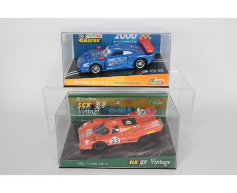Scalextric - SCX - 2 x boxed Porsche models, a 911 GT1 Millenium Edition # 6043 and a limited edition Vintage 917 which is nu