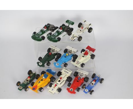 Scalextric - 11 x unboxed race cars including Europa # C5, March 771 # C129, Arrow # C23 and others. All show light signs of 