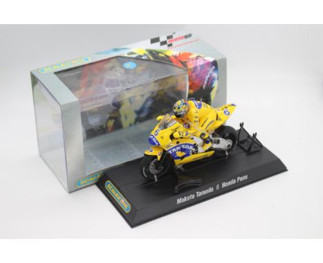 Scalextric - A boxed 2004 Moto GP Honda Pons ridden by Makoto Tamada # C6002 The model appears Mint in a Very Good perspex di