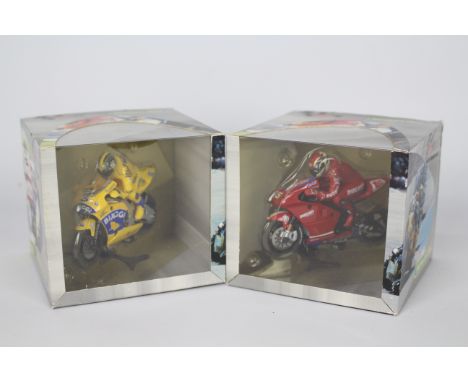 Scalextric - 2 x boxed 2004 Moto GP bikes, a Ducatti Desmosedici ridden by Loris Capirossi # C6008 and a Honda ridden by Max 