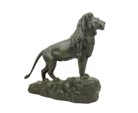 After François Auguste Hippolyte Peyrol (1856-1926), a bronze model, 'Lion in Majesty' standing upon a rocky mound, signed in