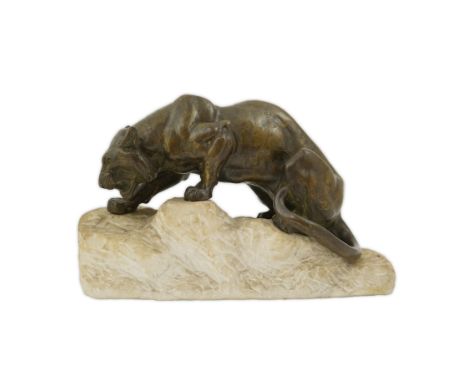 Manner of Giacomo Merculiano (Italian, 1859-1935), a bronze model of a crouching tiger, on naturalistic rock plinth. 36cm lon