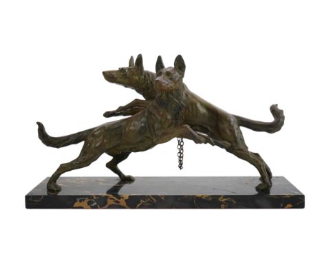 Edouard Drouot (1859-1945), a French Art Deco bronzed spelter group of Alsatians, on variegated marble plinth, 60cm wide, 16c