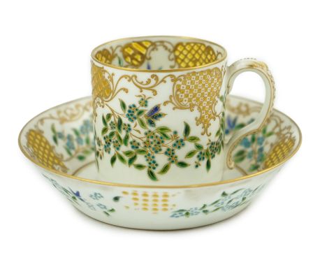 Camille Naudot (1862-1938), a rare porcelain and openwork enamel coffee cup and saucer, c.1900, finely decorated with turquoi