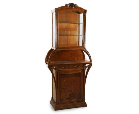 Louis Majorelle (French, 1859-1926), a French Art Nouveau marquetry inlaid oak 'Chicoree' pattern vitrine, with floral carved