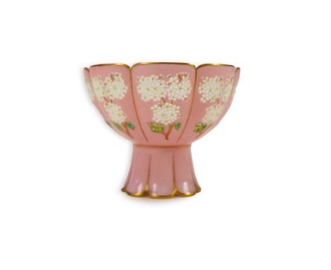 Camille Naudot (1862-1938), a rare porcelain and openwork enamel pink ground footed cup, c.1900, decorated with translucent f