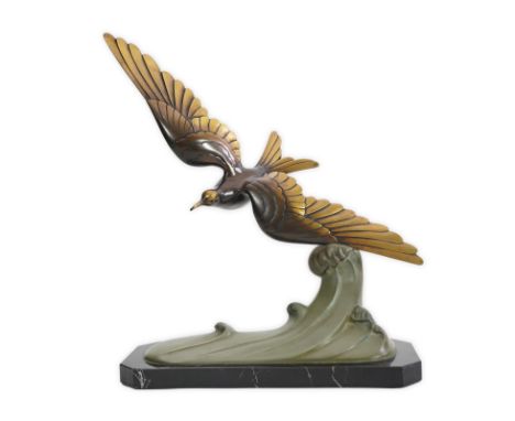 J. Brault, a French Art Deco patinated bronze model of a seagull in flight, signed in the bronze, stamped bronze, on variegat