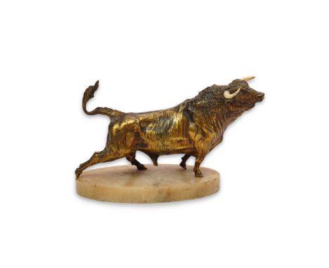 An early 20th century French gilt bronze model of a roaring bull, with ivory horns, on alabaster plinth, 32cm long, 19cm high