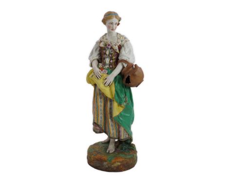 An exhibition size Gille Jeune of Paris enamelled biscuit porcelain figure of a female gardener, mid 19th century, holding fl