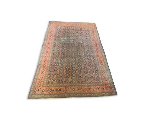 A Mahal blue ground carpet, first half 20th century, with field of geometric motifs, multu-bordered, 496 x 348cm PLEASE NOTE: