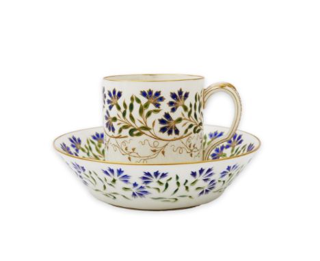 Camille Naudot (1862-1938), a rare porcelain and openwork enamel coffee cup and saucer, c.1900, decorated with cornflowers, t
