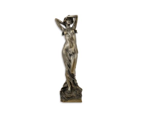 A. J. Scotte, French 1867-1925), an Art Nouveau silvered bronze figure of a bather in diaphonous dress, standing upon a natur