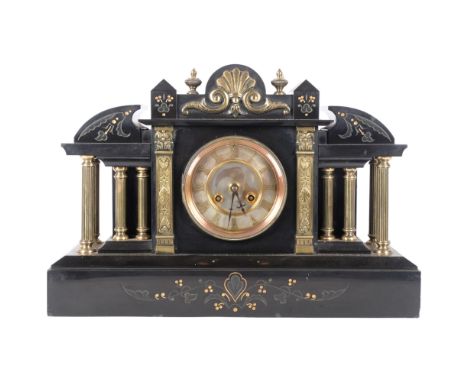 A Victorian architectural and black slate mantle clock, 8 day movement with silver dial and roman numerals. H - 32cm. With pe