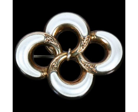 A Norwegian sterling silver-gilt white enamel openwork brooch, maker JA, 41.1mm, 8.3gNo damage or repair, only light surface 