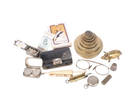 A graduated set of brass weights, a brass pig censer, chrome plated sovereign case, playing cards, vintage items etc. 