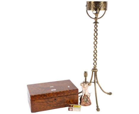 An Antique brass oil lamp stand, H86cm, with spiral turned column and decorative paw feet, a ceramic table lamp, with cherub 