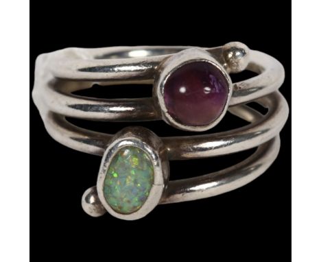 A mid-20th century Danish modernist amethyst and composite opal spiral ring, unmarked white metal settings, setting height 15