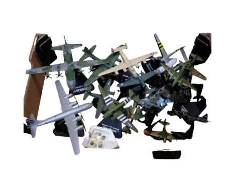 A box of diecast model aircraft on stands 