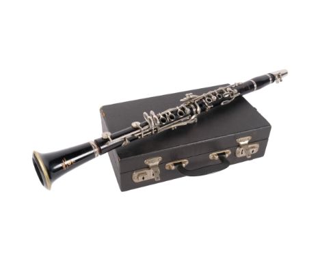Boosey & Hawkes Ltd - The edgeware clarinet, SN 185522, in hard shell case, with various solo musical books. 