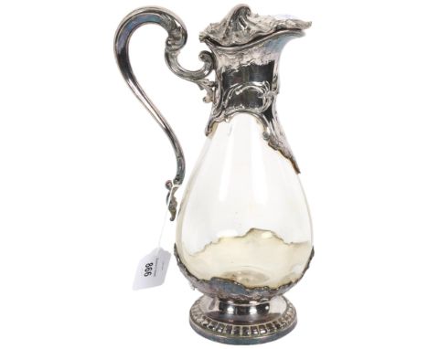 A French Claret jug, with embossed silver plated mounts and clear glass body, impressed France to the underneath, with intern