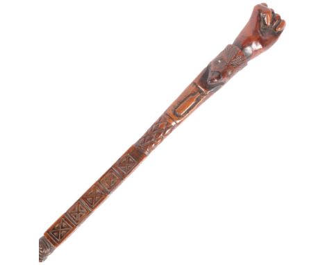 An ornately carved 19th century Folk Art walking stick, with inlaid metal playing card design motifs, the handle in the form 