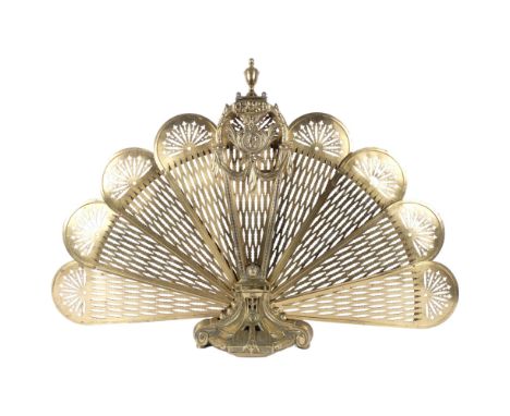 A Victorian ornate pierced brass peacock fan firescreen on cast base. H - 68cm. 