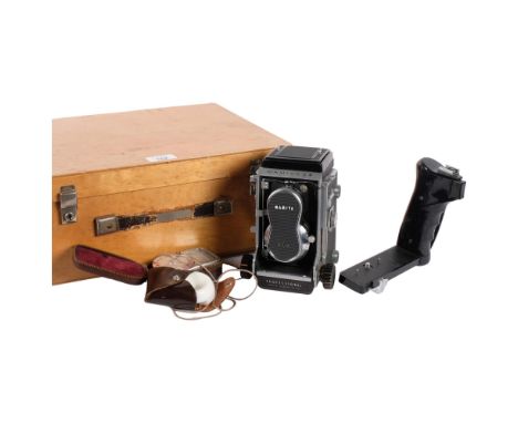 A Mamiya C3 professional twin-lens reflex camera, with associated Mamiya-sekor lenses (serials 1150669 + 1149675), bracket su