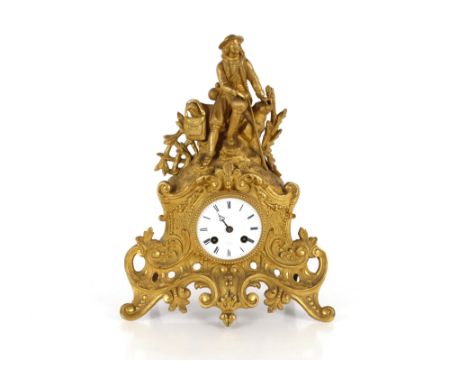 A 19th Century French mantel clock, the case surmounted by a seated figure with circular white enamel dial, by Henri Marc Par