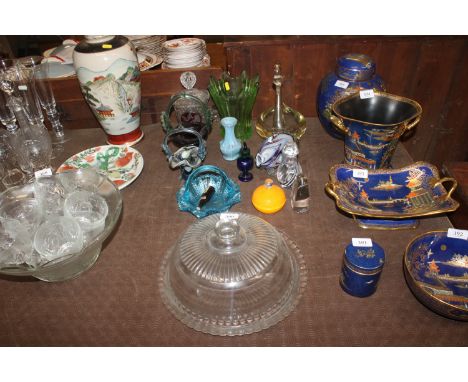 A quantity of various glassware to include mottled glass fish; Art Glass baskets; swan; jar and cover; green glass vase etc.