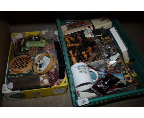 Two boxes containing various games to include chess, draughts etc. 