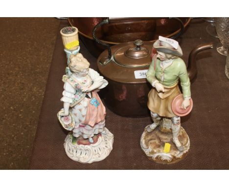 A continental porcelain figure "The Gentleman" and a continental porcelain figure decorated candlestick