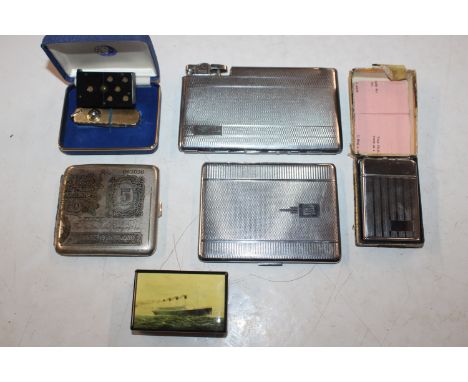 A box containing cigarette cases, cigarette lighter, a Vesta case in the form of a domino, penknife etc.