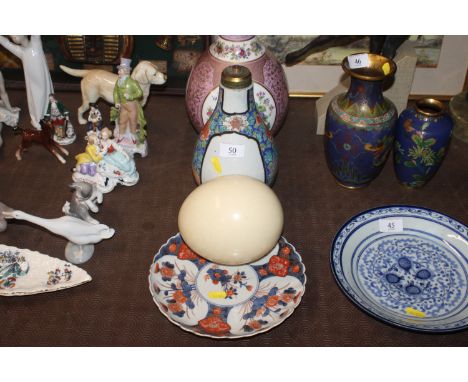 An Oriental floral decorated vase, converted to a table lamp base with character marks to base; an Imari pattern plate; and a