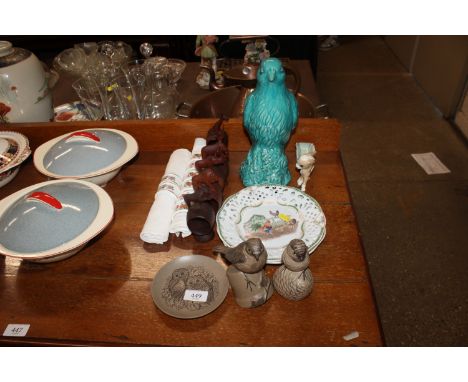 Three items of Poole pottery; two Oriental plates decorated with hen houses, napkin rings etc.