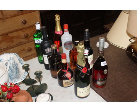A bottle of Gordons Dry Gin, a bottle of Moet Chandon Champagne, a bottle of Remy Martin Fine Champagne Cognac etc.