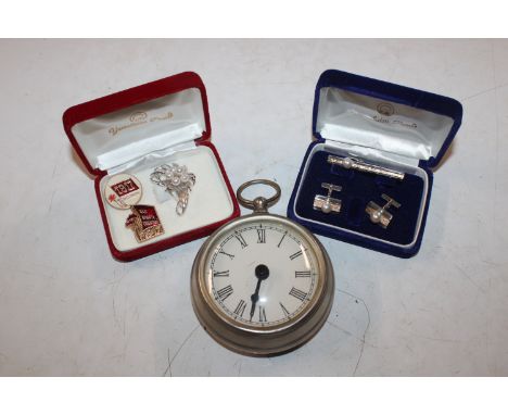 A pocket watch; a pair of silver Yamakatsu pearl set cufflinks and tie clip; a white metal floral brooch; two Russian badges