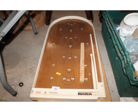 A boxed bagatelle board 