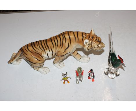 A model tiger and four Art Glass ornaments 