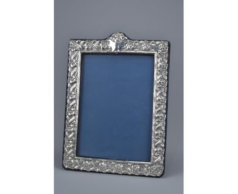 A late 20th Century London Sterling Silver photo frame with stand. Stamped B S C ltd 1994. 27cm x 34cm