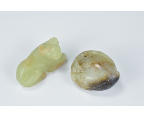 Two Chinese Celadon Jade Carvings in the form of a Cow, 4cms and a Peach Pendant, 3.5cms (2)
