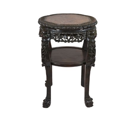 A quality and large 19th century Chinese hardwood jardiniere stand with marble top insert carved decoration with four lion fe
