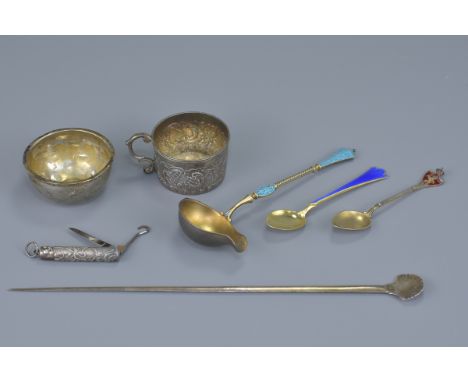 A Russian silver cup with three continental enamelled spoons, a continental punch ladle bowl, a pocket knife with folding bla