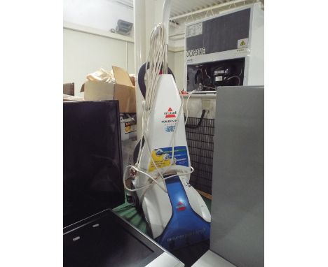 A Bissell Power Wash Carpet Cleaner