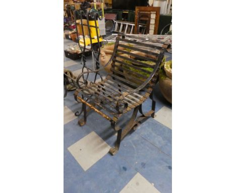 A Vintage Wrought Iron Garden Arm Chair with Scrolled Supports