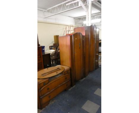 A Vintage Oak Four Piece Bedroom Suite Comprising Gents and Ladies Wardrobes, Dressing Table and Bedside Cabinet