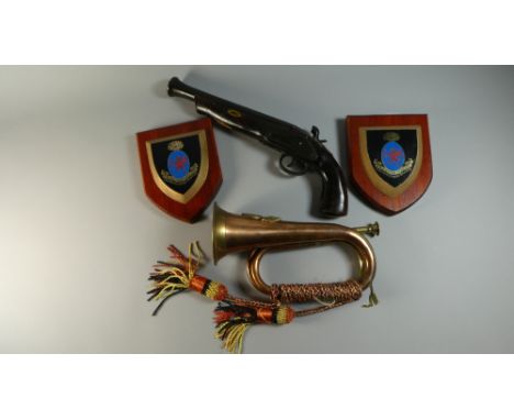 A Reproduction Copper and Brass Military Bugle, Replica Percussion Cap Pistol and Two Military Comrades Association Shields  