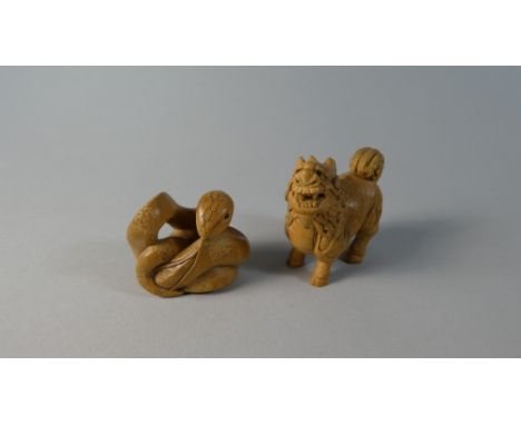 A Carved Oriental Wooden Netsuke of a Snake and a Temple Lion, Signed