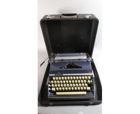 A Vintage Adler Portable Typewriter 