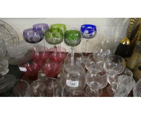 A Tray of Glassware to Include Six Coloured Hock Glasses, Four Cranberry Bowl Wines, Brandy Balloons etc