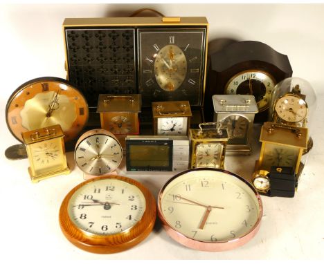 A collection of mantel clocks, carriage clocks, anniversary clocks and barometers, having manual wind and quartz movements. (